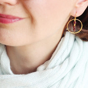 garnet gold hoop earrings styled
