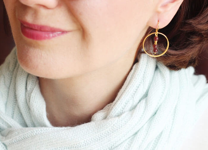 garnet gold hoop earrings styled